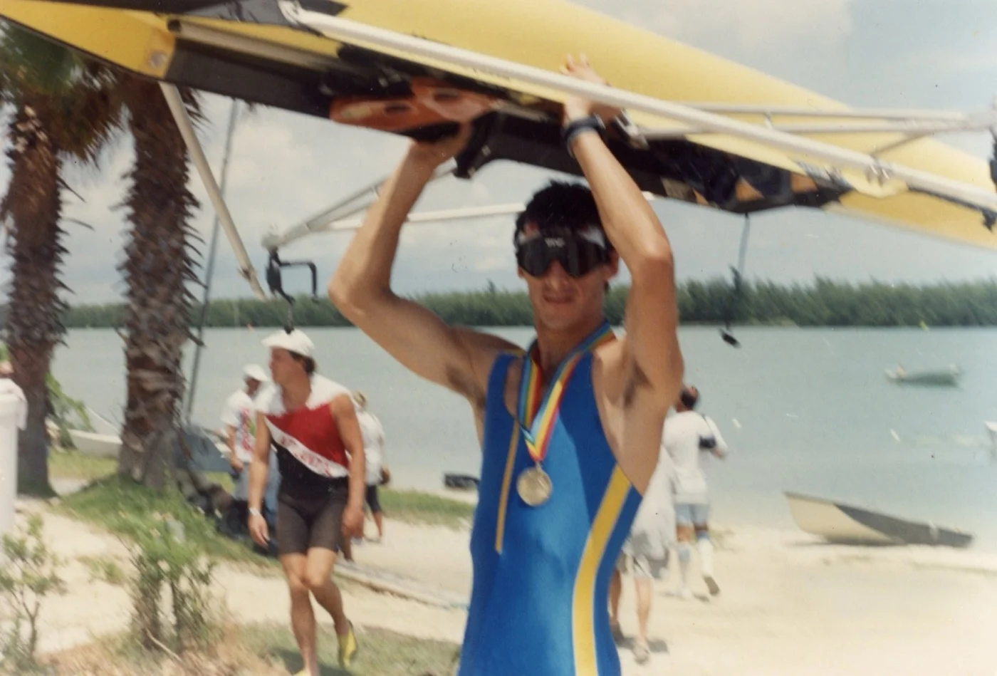 Luis with medal after a race